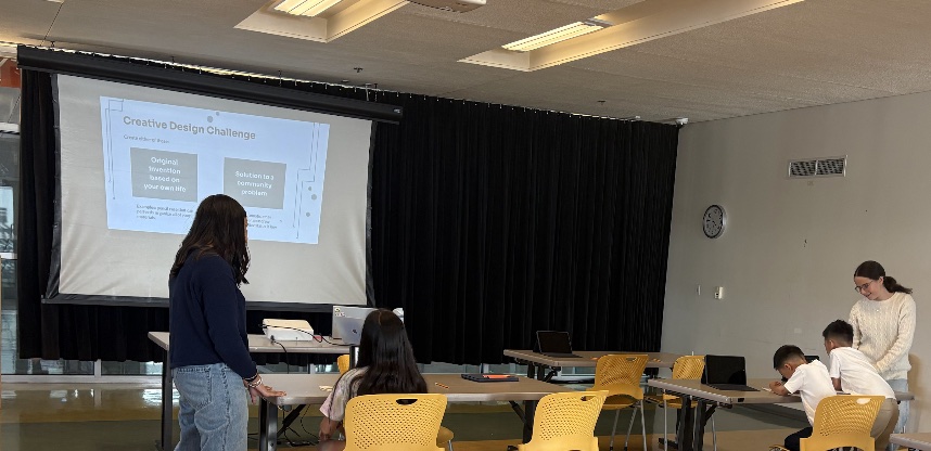 Next Vision AI leaders guiding students through a creative design challenge